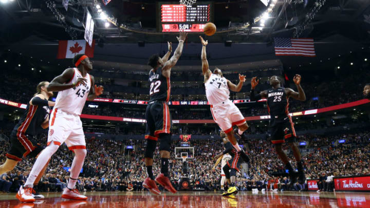 Kyle Lowry #7 of the Toronto Raptors shoots the ball as Jimmy Butler #22 of the Miami Heat defends(Photo by Vaughn Ridley/Getty Images)