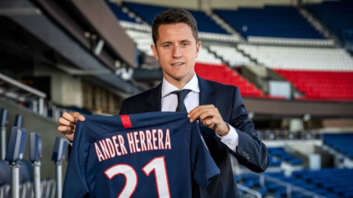 Spanish midfielder Ander Herrera poses with the PSG jersey after he signed a five-year contract with the Paris Saint-Germain football club at the Parc des Princes, in Paris on July 4, 2019. - Herrera has joined Paris Saint-Germain on a free transfer after leaving Manchester United, the French champions announced on July 4, 2019. (Photo by BERTRAND GUAY / AFP) (Photo credit should read BERTRAND GUAY/AFP/Getty Images)