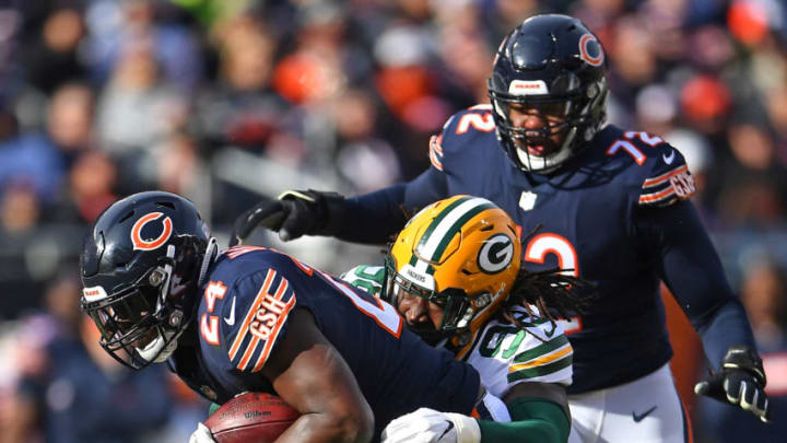 CHICAGO, IL - DECEMBER 16: Fadol Brown #98 of the Green Bay Packers tackles Jordan Howard #24 of the Chicago Bears in the first quarter at Soldier Field on December 16, 2018 in Chicago, Illinois. (Photo by Stacy Revere/Getty Images)