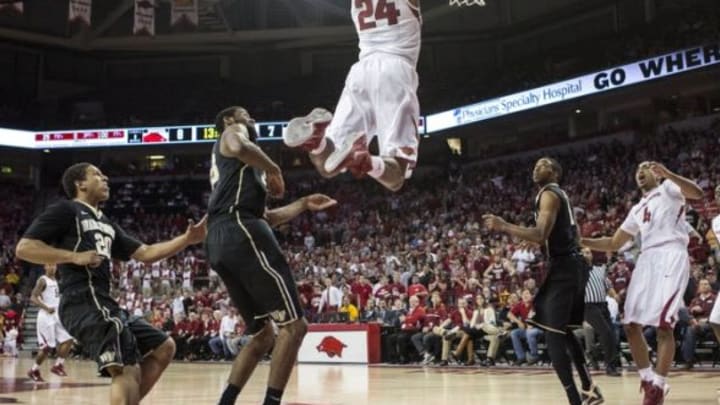 Nov 19, 2014; Fayetteville, AR, USA; Arkansas Razorbacks guard Michael Qualls (24) dunks the ball in against the Wake Forest Demon Deacons during the first half at Bud Walton Arena. Mandatory Credit: Beth Hall-USA TODAY Sports