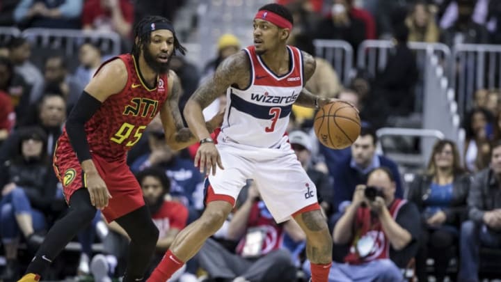 WASHINGTON, DC - FEBRUARY 4: Bradley Beal #3 of the Washington Wizards handles the ball against DeAndre' Bembry #95 of the Atlanta Hawks during the second half at Capital One Arena on February 4, 2019 in Washington, DC. NOTE TO USER: User expressly acknowledges and agrees that, by downloading and or using this photograph, User is consenting to the terms and conditions of the Getty Images License Agreement. (Photo by Scott Taetsch/Getty Images)