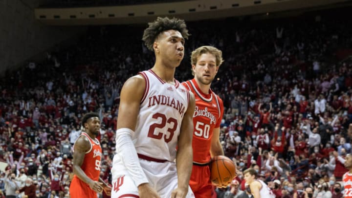 Jan 6, 2022; Bloomington, Indiana, USA; Indiana Hoosiers forward Trayce Jackson-Davis (23) reacts a slam dunk while Ohio State Buckeyes guard Jamari Wheeler (55) watches in the first half at Simon Skjodt Assembly Hall. Mandatory Credit: Trevor Ruszkowski-USA TODAY Sports