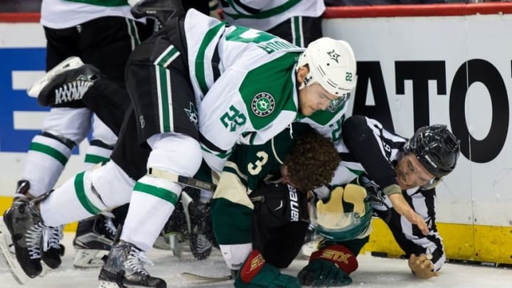 Apr 18, 2016; Saint Paul, MN, USA; Dallas Stars forward Colton Sceviour (22) and Minnesota Wild forward Charlie Coyle (3) wrestle after the whistle in the second period in game three of the first round of the 2016 Stanley Cup Playoffs at Xcel Energy Center. Mandatory Credit: Brad Rempel-USA TODAY Sports