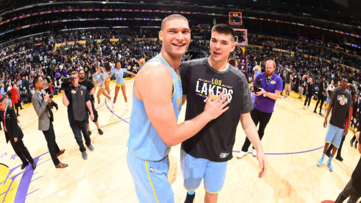 LOS ANGELES, CA - MARCH 7: Brook Lopez #11 and Ivica Zubac #40 of the Los Angeles Lakers celebrate after a victory over the Orlando Magic at STAPLES Center on March 7, 2017 in Los Angeles, California. NOTE TO USER: User expressly acknowledges and agrees that, by downloading and/or using this Photograph, user is consenting to the terms and conditions of the Getty Images License Agreement. Mandatory Copyright Notice: Copyright 2017 NBAE (Photo by Andrew D. Bernstein/NBAE via Getty Images)