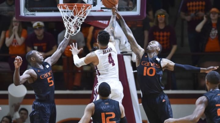 Mar 5, 2016; Blacksburg, VA, USA; Miami Hurricanes guard Davon Reed (5) and guard Sheldon McClellan (10) defend the shot attempt of Virginia Tech Hokies guard Seth Allen (4) in the first half at Cassell Coliseum. Mandatory Credit: Michael Shroyer-USA TODAY Sports