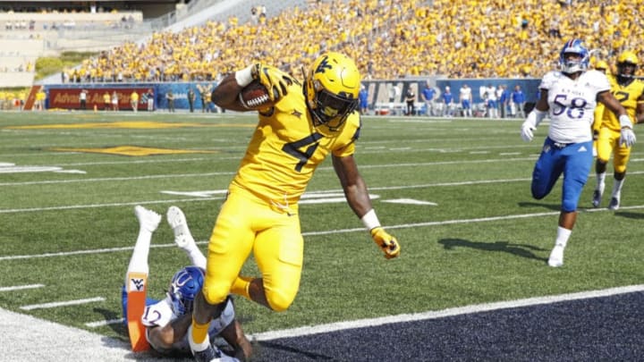 MORGANTOWN, WV - OCTOBER 06: Leddie Brown #4 of the West Virginia Mountaineers runs into the end zone for a 15-yard touchdown after catching a pass against the Kansas Jayhawks in the first quarter of the game at Mountaineer Field on October 6, 2018 in Morgantown, West Virginia. (Photo by Joe Robbins/Getty Images)