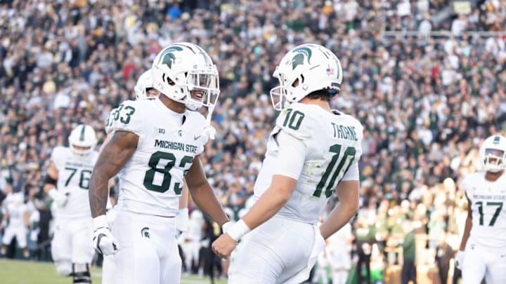 Nov 6, 2021; West Lafayette, Indiana, USA; Michigan State Spartans quarterback Payton Thorne (10) celebrates his touchdown with Michigan State Spartans wide receiver Montorie Foster (83) in the second half against the Purdue Boilermakers at Ross-Ade Stadium. Mandatory Credit: Trevor Ruszkowski-USA TODAY Sports