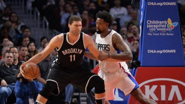 Feb 29, 2016; Los Angeles, CA, USA; Brooklyn Nets center Brook Lopez (11) is defended by Los Angeles Clippers center DeAndre Jordan (6) during an NBA game at the Staples Center. Mandatory Credit: Kirby Lee-USA TODAY Sports