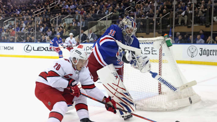 NEW YORK, NEW YORK - APRIL 26: Igor Shesterkin #31 of the New York Rangers shoots the puck away from Sebastian Aho #20 of the Carolina Hurricanes during the second period at Madison Square Garden on April 26, 2022 in New York City. The Hurrricanes defeated the Rangers 4-3. (Photo by Bruce Bennett/Getty Images)