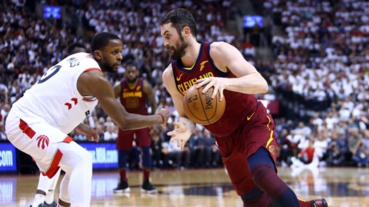 TORONTO, ON - MAY 03: Kevin Love #0 of the Cleveland Cavaliers dribbles the ball as C.J. Miles #0 of the Toronto Raptors defends in the second half of Game Two of the Eastern Conference Semifinals during the 2018 NBA Playoffs at Air Canada Centre on May 3, 2018 in Toronto, Canada. NOTE TO USER: User expressly acknowledges and agrees that, by downloading and or using this photograph, User is consenting to the terms and conditions of the Getty Images License Agreement. (Photo by Vaughn Ridley/Getty Images)