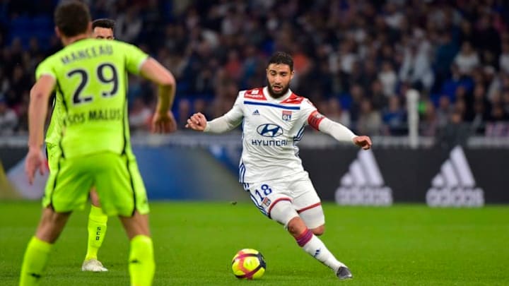 Lyon's French forward Nabil Fekir (R) runs with the ball during the French L1 football match between Lyon (OL) and Angers (SCO) on April 19, 2019, at the Groupama Stadium in Decines-Charpieu, near Lyon, central-eastern France. (Photo by ROMAIN LAFABREGUE / AFP) (Photo credit should read ROMAIN LAFABREGUE/AFP/Getty Images)