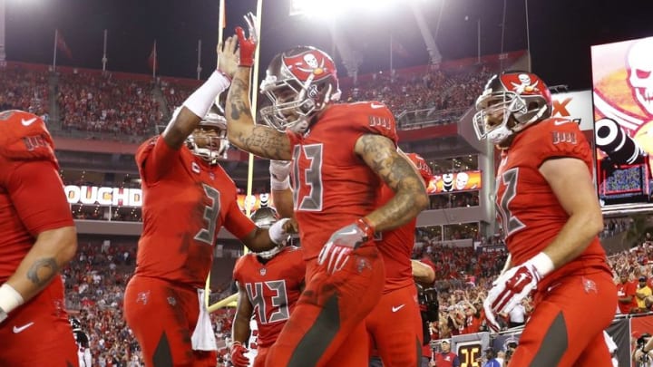 Nov 3, 2016; Tampa, FL, USA; Tampa Bay Buccaneers wide receiver Mike Evans (13) celebrates with quarterback Jameis Winston (3) after scoring a touchdown against the Atlanta Falcons during the first quarter at Raymond James Stadium. Mandatory Credit: Kim Klement-USA TODAY Sports