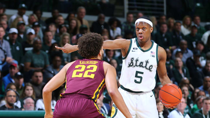 EAST LANSING, MI – FEBRUARY 09: Cassius Winston #5 of the Michigan State Spartans directs play while defended by Gabe Kalscheur #22 of the Minnesota Golden Gophers in the first half at Breslin Center on February 9, 2019 in East Lansing, Michigan. (Photo by Rey Del Rio/Getty Images)