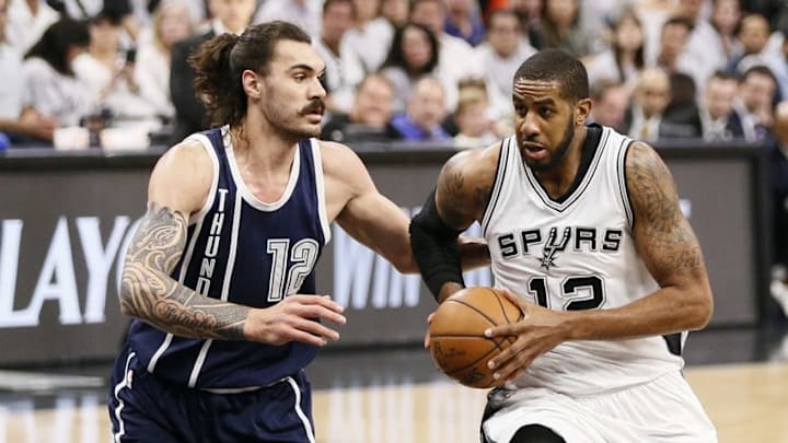 Apr 30, 2016; San Antonio, TX, USA; San Antonio Spurs power forward LaMarcus Aldridge (12) drives to the basket against Oklahoma City Thunder center Steven Adams (12) in game one of the second round of the NBA Playoffs at AT&T Center. Mandatory Credit: Soobum Im-USA TODAY Sports