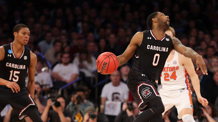 Mar 26, 2017; New York, NY, USA; Florida Gators forward Justin Leon (23) fouls South Carolina Gamecocks guard Sindarius Thornwell (0) during the second half in the finals of the East Regional of the 2017 NCAA Tournament at Madison Square Garden. Mandatory Credit: Brad Penner-USA TODAY Sports