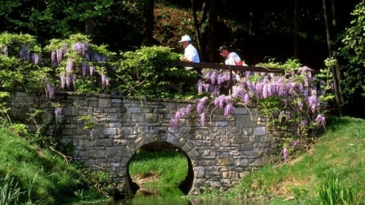 4 May 1997: Costantino Rocca of Italy and his caddy walk across the bridge at the eighth hole during the Italian Open at the Gardagolf Club in Brescia, Italy. Mandatory Credit: Andrew Redington/Allsport