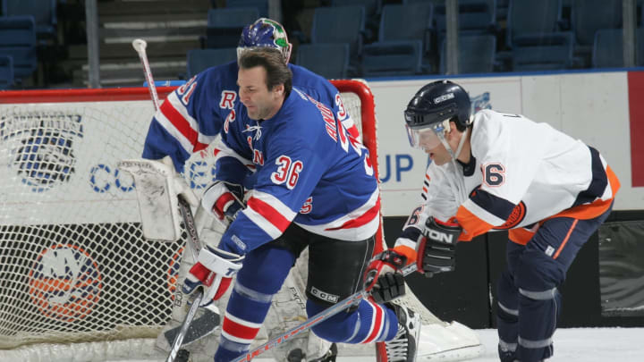 UNIONDALE, NY – APRIL 16: Glenn Anderson #36 of the New York Rangers Alumni and Pat Lafontaine #16 of the New York Islanders Alumni battle for the puck during the Hockey for Heroes 3 on 3 Hockey Tournament on April 16, 2005 at Nassau Coliseum in Uniondale, New York. (Photo by Bruce Bennett/Getty Images)