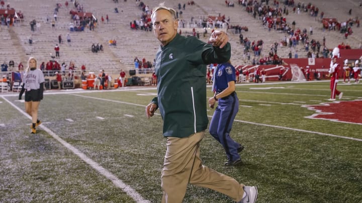 BLOOMINGTON, IN – SEPTEMBER 22: Head coach Mark Dantonio of the Michigan State Spartans runs off the field and acknowledges fans following the win over the Indiana Hoosiers at Memorial Stadium on September 22, 2018 in Bloomington, Indiana. (Photo by Michael Hickey/Getty Images)