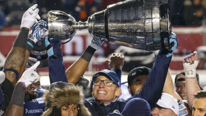 OTTAWA, ON - NOVEMBER 26: Toronto Argonauts head coach Marc Trestman raises the Grey Cup over his head as he celebrates winning the 105th Grey Cup Championship Game against the Calgary Stampeders at TD Place Stadium on November 26, 2017 in Ottawa, Canada. (Photo by Andre Ringuette/Getty Images)