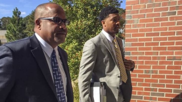 Dec 2, 2014; Tallahassee, FL, USA; Florida State Seminoles quarterback Jameis Winston (right) and his advisor David Cornwell arrive for an investigative hearing on the campus of Florida State. Mandatory Credit: Rachel Axon-USA TODAY Sports