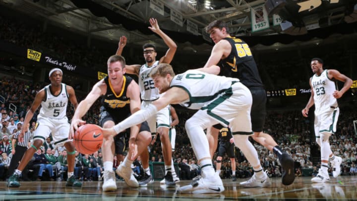 EAST LANSING, MI - DECEMBER 03: Connor McCaffery #30 of the Iowa Hawkeyes fight for a loose ball against Kyle Ahrens #0 of the Michigan State Spartans at Breslin Center on December 3, 2018 in East Lansing, Michigan. (Photo by Rey Del Rio/Getty Images)