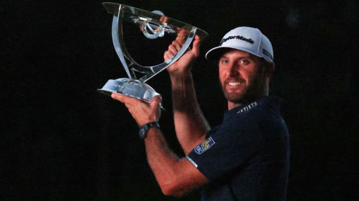 NORTON, MASSACHUSETTS - AUGUST 23: Dustin Johnson of the United States celebrates with the trophy after going 30-under par to win during the final round of The Northern Trust at TPC Boston on August 23, 2020 in Norton, Massachusetts. (Photo by Maddie Meyer/Getty Images)
