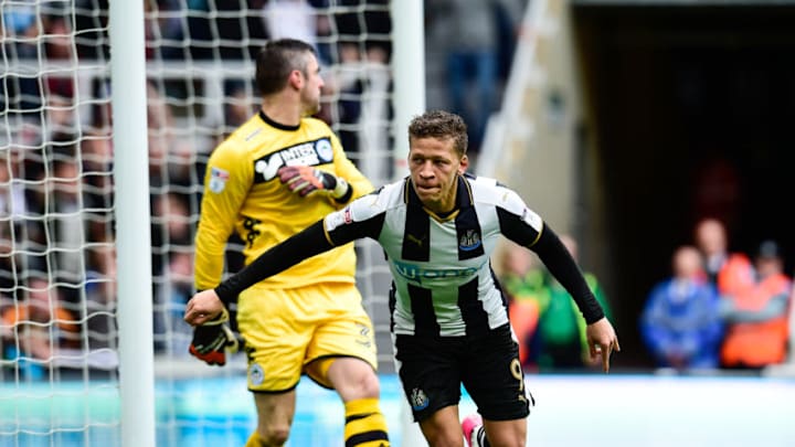 NEWCASTLE, ENGLAND - APRIL 1: Dwight Gale of Newcastle United (09) scores the opening goal past Wigan Athletic Goalkeeper Matt Gilks (35) during the Sky Bet Championship match between Newcastle United and Wigan Athletic at St.James' Park on April 1, 2017 in Newcastle upon Tyne, England. (Photo by Serena Taylor/Newcastle United via Getty Images)