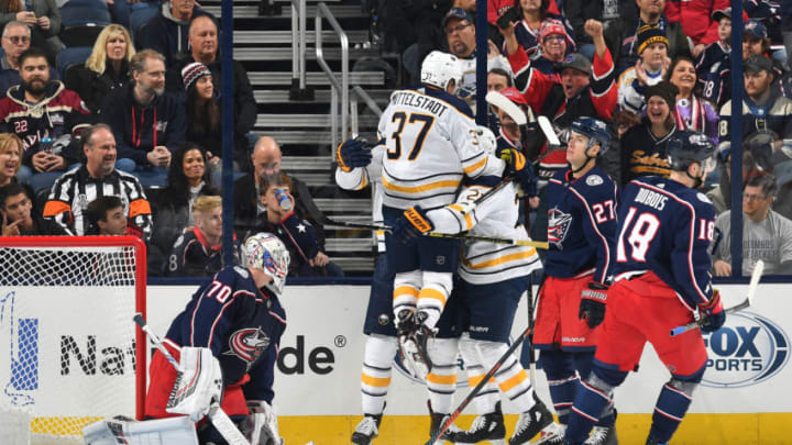 COLUMBUS, OH - OCTOBER 27: Casey Mittelstadt #37 of the Buffalo Sabres reacts to the goal scored by Kyle Okposo #21 of the Buffalo Sabres against the Columbus Blue Jackets in the first period on October 27, 2018 at Nationwide Arena in Columbus, Ohio. (Photo by Jamie Sabau/NHLI via Getty Images)