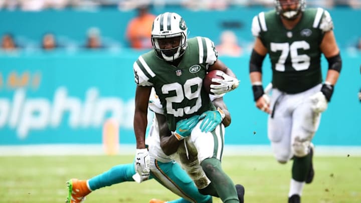 MIAMI GARDENS, FL - OCTOBER 22: Bilal Powell #29 of the New York Jets rushes against Reshad Jones #20 of the Miami Dolphins during the second quarter at Hard Rock Stadium on October 22, 2017 in Miami Gardens, Florida. (Photo by Rob Foldy/Getty Images)