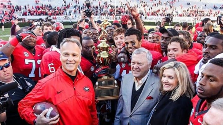 November 24, 2012; Athens, GA, USA; The Georgia Bulldogs and head coach Mark Richt accept the Governors Cup after the game against the Georgia Tech Yellow Jackets at Sanford Stadium. Georgia won 42-10. Mandatory Credit: Daniel Shirey-USA TODAY Sports