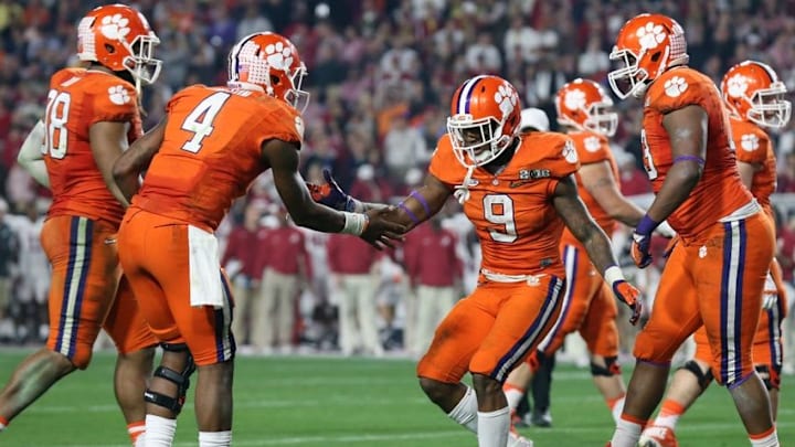 Jan 11, 2016; Glendale, AZ, USA; Clemson Tigers running back Wayne Gallman (9) celebrates with Deshaun Watson (4) after scoring on a 1 yard run during the third quarter in the 2016 CFP National Championship at University of Phoenix Stadium. Mandatory Credit: Matthew Emmons-USA TODAY Sports