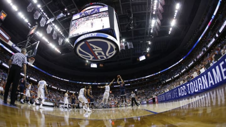 Mar 12, 2016; Washington, DC, USA; Virginia Cavaliers guard London Perrantes (32) shoots the ball over North Carolina Tar Heels guard Joel Berry II (2) in the second half during the championship game of the ACC conference tournament at Verizon Center. The Tar Heels won 61-57. Mandatory Credit: Geoff Burke-USA TODAY Sports