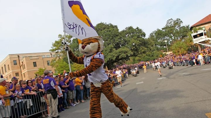 Oct 17, 2015; Baton Rouge, LA, USA; LSU Tigers mascot Mike the Tiger runs past fans prior to kickoff against the Florida Gators at Tiger Stadium. Mandatory Credit: Crystal LoGiudice-USA TODAY Sports