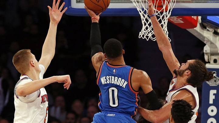 Nov 28, 2016; New York, NY, USA; Oklahoma City Thunder guard Russell Westbrook (0) drives to the basket between New York Knicks center Joakim Noah (13) and forward Kristaps Porzingis (6) during the second half at Madison Square Garden. Mandatory Credit: Adam Hunger-USA TODAY Sports Nov 28, 2016; New York, NY, USA; Oklahoma City Thunder guard Russell Westbrook (0) drives to the basket between New York Knicks center Joakim Noah (13) and forward Kristaps Porzingis (6) during the second half at Madison Square Garden. Mandatory Credit: Adam Hunger-USA TODAY Sports