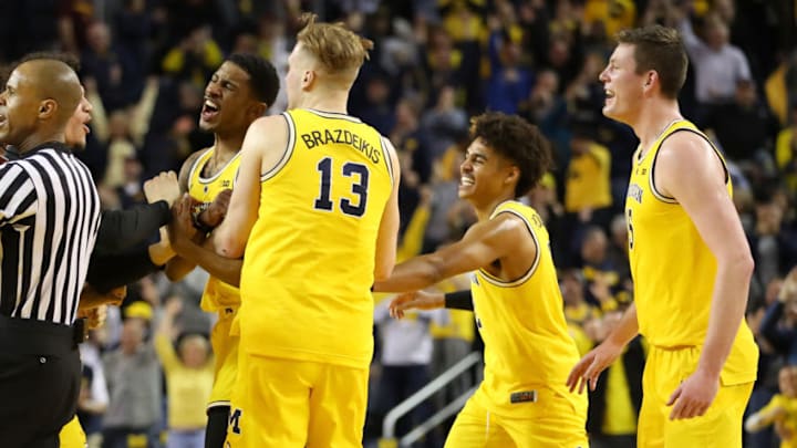 ANN ARBOR, MICHIGAN - JANUARY 22: Charles Matthews #1 of the Michigan Wolverines celebrates his buzzer beater game winning shot to beat the Minnesota Golden Gophers 59-57 with Ignas Brazdeikis #13, Jon Teske #15 and Jordan Poole #2 at Crisler Arena on January 22, 2019 in Ann Arbor, Michigan. (Photo by Gregory Shamus/Getty Images)