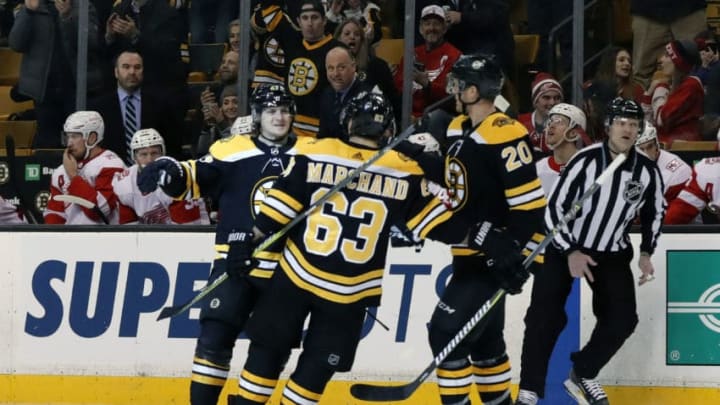 BOSTON, MA - MARCH 06: Teammates rush in to congratulate Boston Bruins left defenseman Torey Krug (47) on his goal in the first minute during a game between the Boston Bruins and the Detroit Red Wings on March 6, 2018, at TD Garden in Boston, Massachusetts. The Bruins defeated the Red Wings 6-5 (OT). (Photo by Fred Kfoury III/Icon Sportswire via Getty Images)