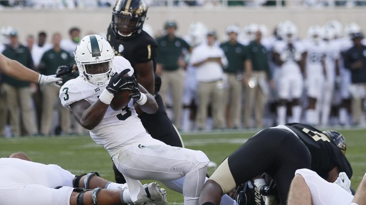 EAST LANSING, MI – SEPTEMBER 09: Running back LJ Scott #3 of the Michigan State Spartans breaks past linebacker Caleb Bailey #8 of the Western Michigan Broncos for a touchdown during the second half at Spartan Stadium on September 9, 2017 in East Lansing, Michigan. (Photo by Duane Burleson/Getty Images)