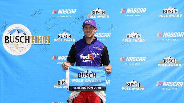 DARLINGTON, SC - SEPTEMBER 01: Denny Hamlin, driver of the #11 FedEx Throwback Toyota, poses with the Busch Pole Award after qualying on the pole position during qualifying for the Monster Energy NASCAR Cup Series Bojangles' Southern 500 at Darlington Raceway on September 1, 2018 in Darlington, South Carolina. (Photo by Josh Hedges/Getty Images)