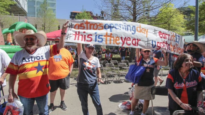 HOUSTON, TX - APRIL 03: Fans carry signs during Houston Astros Fan Fest before playing the Seattle Mariners on opening day at Minute Maid Park on April 3, 2017 in Houston, Texas. (Photo by Bob Levey/Getty Images)