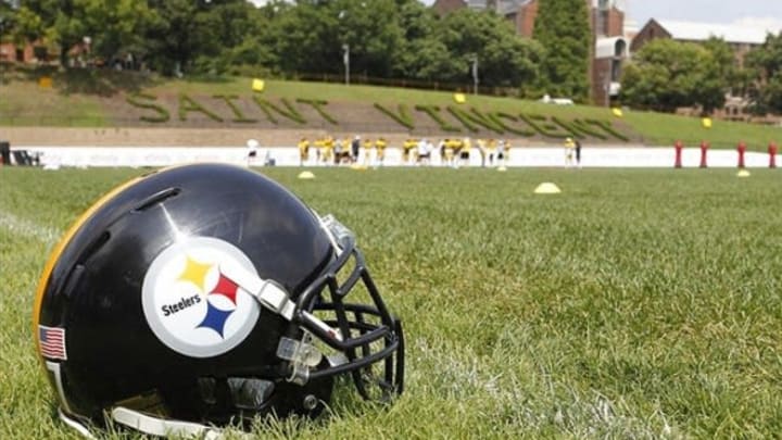 Aug 12, 2013; Latrobe, PA, USA; Pittsburgh Steelers helmet rests on the field during training camp at Saint Vincent College. Mandatory Credit: Charles LeClaire-USA TODAY Sports