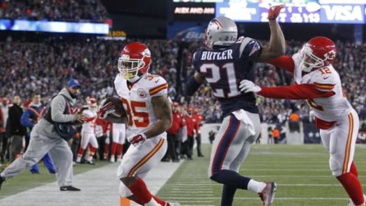 Jan 16, 2016; Foxborough, MA, USA; Kansas City Chiefs running back Charcandrick West (35) scores a touchdown past New England Patriots cornerback Malcolm Butler (21) during the second half in the AFC Divisional round playoff game at Gillette Stadium. The Patriots won 20-27. Mandatory Credit: Stew Milne-USA TODAY Sports