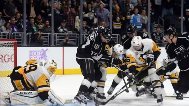 November 3, 2016; Los Angeles, CA, USA; Pittsburgh Penguins defenseman Ian Cole (28) and center Eric Fehr (16) help goalie Marc-Andre Fleury (29) defend the goal against Los Angeles Kings center Jeff Carter (77), center Anze Kopitar (11) and center Tyler Toffoli (73) during the overtime period at Staples Center. Mandatory Credit: Gary A. Vasquez-USA TODAY Sports