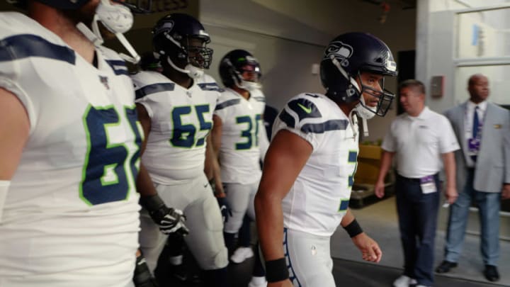 MINNEAPOLIS, MN - AUGUST 18: Russell Wilson #3 of the Seattle Seahawks runs out from the tunnel before the pre-season game against the Minnesota Vikings at U.S. Bank Stadium on August 18, 2019 in Minneapolis, Minnesota. (Photo by Adam Bettcher/Getty Images)