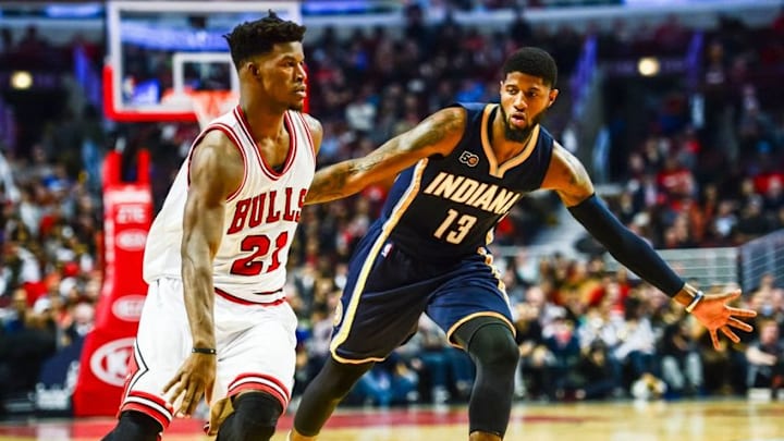 Oct 29, 2016; Chicago, IL, USA; Chicago Bulls guard Jimmy Butler (21) controls the ball as Indiana Pacers forward Paul George (13) defends during the first half at United Center. The Bulls won 118-101. Mandatory Credit: Jeffrey Becker-USA TODAY Sports