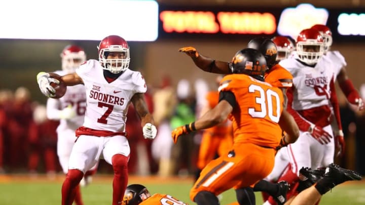 Nov 28, 2015; Stillwater, OK, USA; Oklahoma Sooners cornerback Jordan Thomas (7) returns a second quarter interception against the Oklahoma State Cowboys at Boone Pickens Stadium. Mandatory Credit: Mark J. Rebilas-USA TODAY Sports