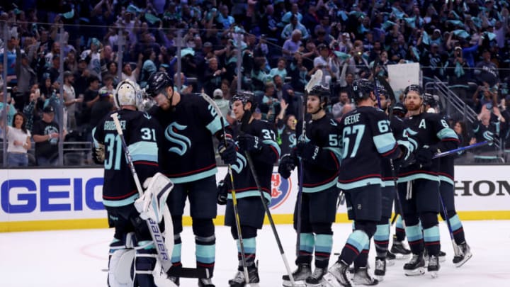 SEATTLE, WASHINGTON - MAY 13: The Seattle Kraken celebrate their 6-3 win against the Dallas Stars in Game Six of the Second Round of the 2023 Stanley Cup Playoffs at Climate Pledge Arena on May 13, 2023 in Seattle, Washington. (Photo by Steph Chambers/Getty Images)