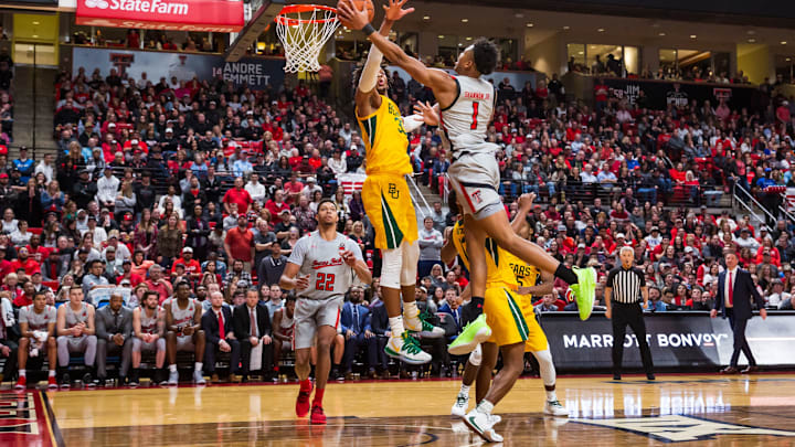 Guard Terrence Shannon Jr. #1 of the Texas Tech Red Raiders jumps to shoot the ball over guard Jared Butler #12 and forward Freddie Gillespie #33 of the Baylor Bears. (Photo by John E. Moore III/Getty Images)