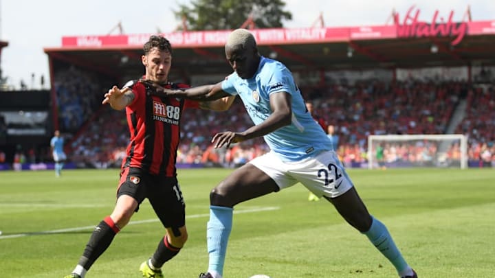 BOURNEMOUTH, ENGLAND - AUGUST 26: Benjamin Mendy of Manchester City holds off Adam Smith of Bournemouth during the Premier League match between AFC Bournemouth and Manchester City at Vitality Stadium on August 26, 2017 in Bournemouth, England. (Photo by Mike Hewitt/Getty Images)