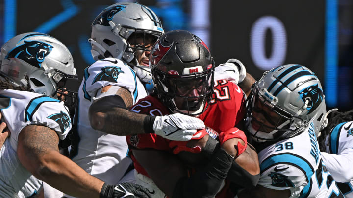 CHARLOTTE, NORTH CAROLINA – OCTOBER 23: Madre Harper #36 of the Carolina Panthers tackles Rachaad White #29 of the Tampa Bay Buccaneers during their game at Bank of America Stadium on October 23, 2022 in Charlotte, North Carolina. (Photo by Grant Halverson/Getty Images)