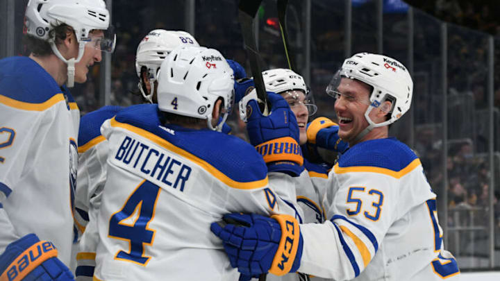 Jan 1, 2022; Boston, Massachusetts, USA; Buffalo Sabres left wing Jeff Skinner (53) celebrates with center Peyton Krebs (19) and defenseman Will Butcher (4) a goal scored by right wing Alex Tuch (89) against the Boston Bruins during the second period at TD Garden. Mandatory Credit: Brian Fluharty-USA TODAY Sports